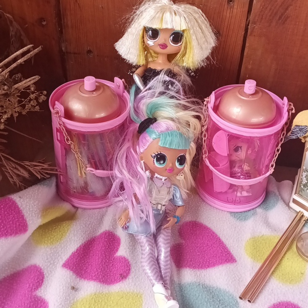 A total of 4 dolls and accessories two little dolls and two medium sized dolls